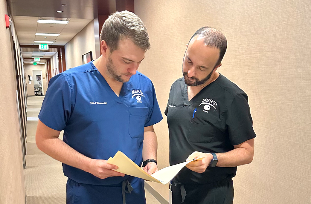 Physicians reviewing detailed retinal imaging at MERSI