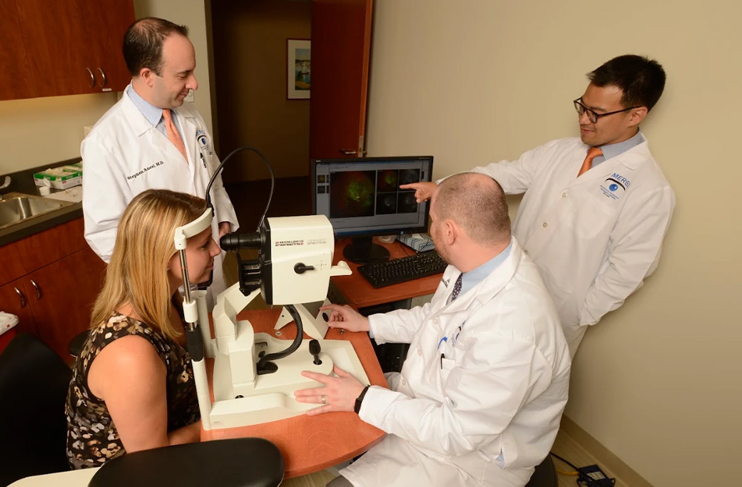 MERSI retina specialist reviewing uveitis test results with a patient