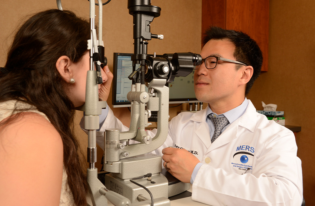 Retina specialist examining a patient for new eye floaters at MERSI