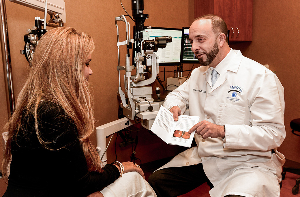 Patient discussing VALEDA eligibility and dry AMD treatment with a retina specialist.