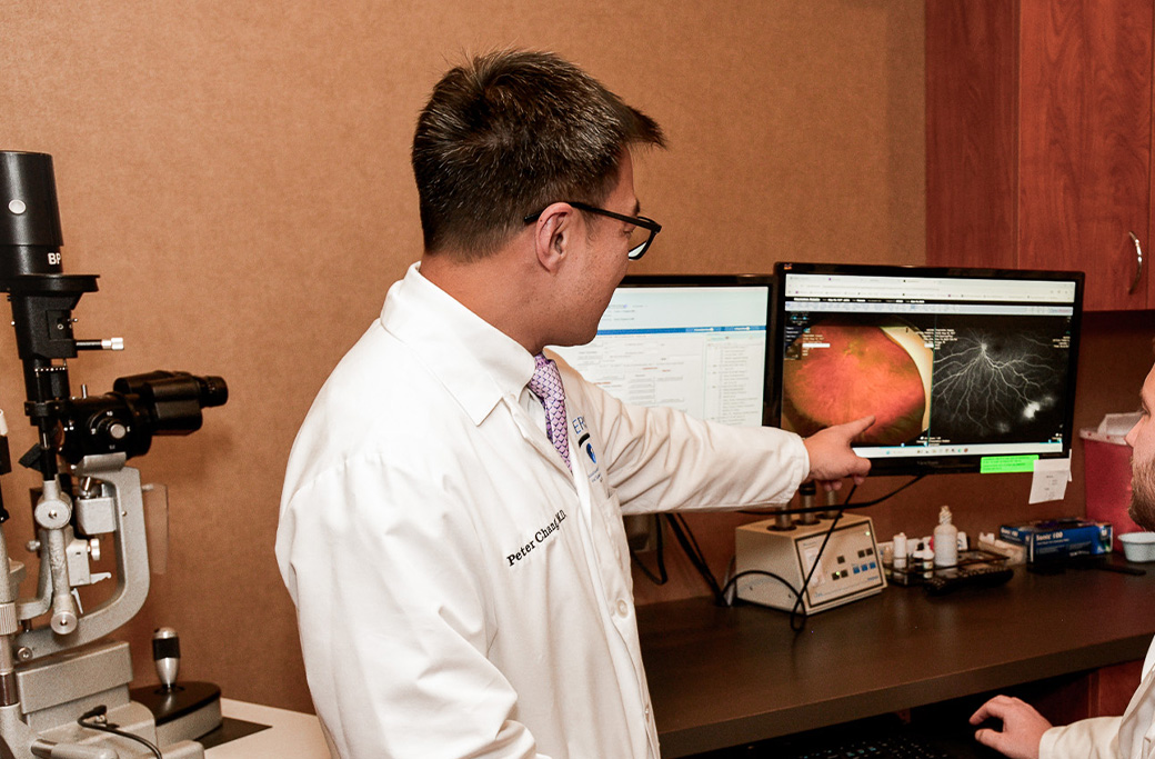 MERSI physician reviewing retinal images during an eye evaluation