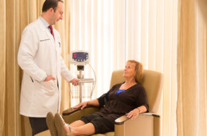 Patient receiving IV infusion therapy for uveitis at MERSI.