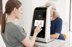 Patient receiving VALEDA photobiomodulation treatment for dry age-related macular degeneration.